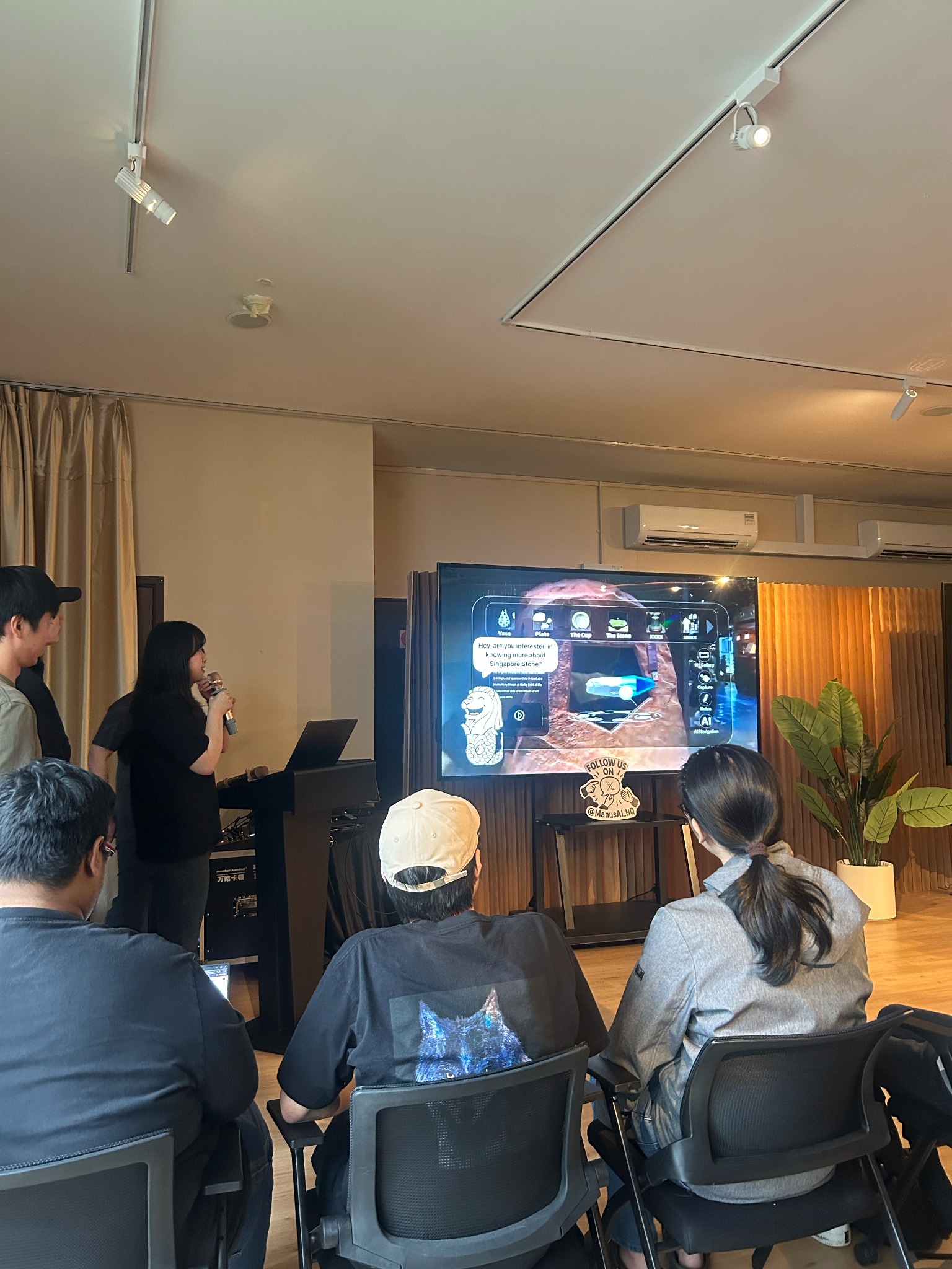 Presenting at the Manus AI Hackathon, where the team placed in the top three